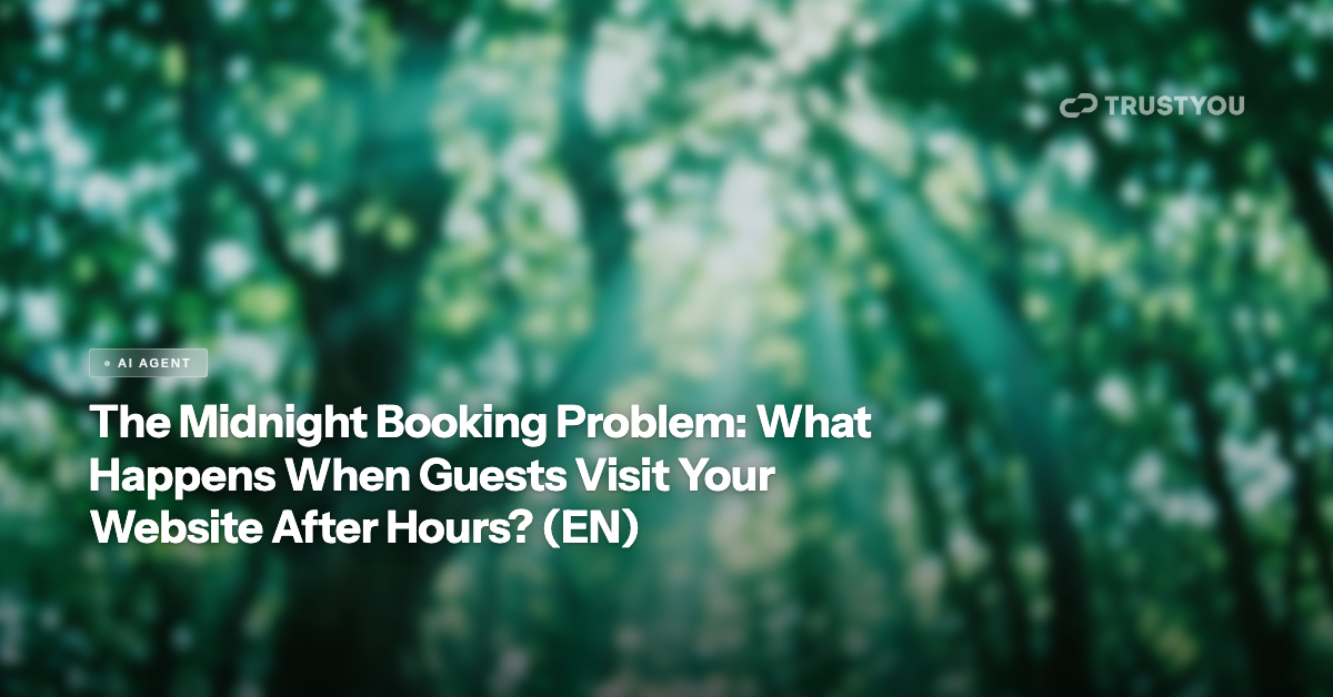 Hotel lobby at night with a glowing booking screen — TrustYou AI Agent blog